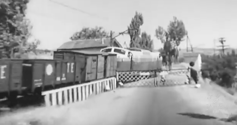 Vagón unificado RENFE TE carbón con Locomotora 7800.png
